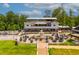 Aerial view of a restaurant with outdoor dining, a fountain, and green spaces at 2325 Ballywater Lea Way, Wake Forest, NC 27587