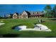Lush golf course featuring a player in a sand trap and golf cart on the fairway at 2325 Ballywater Lea Way, Wake Forest, NC 27587