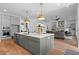Bright kitchen features a large center island, stainless steel appliances, and a seamless transition into the living area at 2325 Ballywater Lea Way, Wake Forest, NC 27587