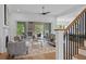 A cozy living area features a fireplace, staircase, and seamless transition into the outdoor space at 2325 Ballywater Lea Way, Wake Forest, NC 27587
