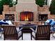 Cozy outdoor fireplace area with comfortable seating and brick accents at 2325 Ballywater Lea Way, Wake Forest, NC 27587