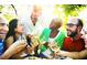 Group of friends toasting wine glasses on an outdoor patio at 2325 Ballywater Lea Way, Wake Forest, NC 27587