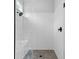 Modern walk-in shower boasts white subway tile, a built-in bench, and modern fixtures at 2325 Ballywater Lea Way, Wake Forest, NC 27587