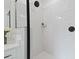 Elegant walk-in shower boasts white subway tile and modern fixtures at 2325 Ballywater Lea Way, Wake Forest, NC 27587