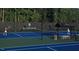 Tennis court with players. Features the Hasentree community name on backdrop at 2325 Ballywater Lea Way, Wake Forest, NC 27587