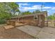 Spacious backyard featuring a wooden deck, patio, and landscaped surroundings at 2409 Parkway Dr, Raleigh, NC 27603