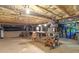 Unfinished basement with exposed ceilings, a workbench, and storage solutions at 2409 Parkway Dr, Raleigh, NC 27603