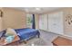 Cozy bedroom with a blue bedspread and two closets, offering ample storage at 2409 Parkway Dr, Raleigh, NC 27603