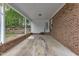 Spacious brick carport with ample parking and side door access at 2409 Parkway Dr, Raleigh, NC 27603