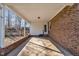 Covered carport with brick accents offering convenient access to the home and outdoor storage, next to a brick home at 2409 Parkway Dr, Raleigh, NC 27603