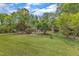 Lush green lawn showcases this charming brick home with delightful blue shutters at 2409 Parkway Dr, Raleigh, NC 27603