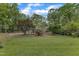 A well-manicured lawn showcases this charming brick home with delightful blue shutters at 2409 Parkway Dr, Raleigh, NC 27603