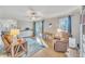 Bright living room featuring wood floors, sliding glass doors, and comfortable seating at 2409 Parkway Dr, Raleigh, NC 27603