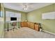 Home office with a corner desk, a sleek computer setup, and ample cabinet space at 2409 Parkway Dr, Raleigh, NC 27603