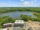 A high-angle shot of modern apartments with a lake view provides a serene and desirable living experience at 2441 Campus Shore # 402, Raleigh, NC 27606