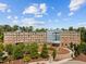 Stunning aerial view of property, with trees and blue skies, showing off a well-maintained exterior at 2441 Campus Shore # 402, Raleigh, NC 27606