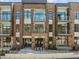 Inviting exterior of a modern brick apartment building featuring private balconies and stylish design at 2441 Campus Shore # 402, Raleigh, NC 27606