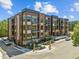 Modern brick apartment complex showcasing contemporary design and outdoor living spaces at 2441 Campus Shore # 402, Raleigh, NC 27606
