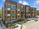 Modern apartment building with brick facade and balconies, offering stylish urban living at 2441 Campus Shore # 402, Raleigh, NC 27606