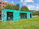 Shot of a green outdoor structure with seating in a grass area with overhead string lights at 2441 Campus Shore # 402, Raleigh, NC 27606