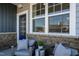 Cozy front porch seating area with stylish chairs, perfect for relaxing and enjoying the outdoors at 2465 Englemann Dr # 365, New Hill, NC 27562