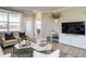 Modern living room with stylish decor, comfortable seating, and a view towards adjacent dining room at 2465 Englemann Dr # 365, New Hill, NC 27562