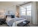 Well-lit main bedroom with a four-poster bed, bench seat, and large windows at 2465 Englemann Dr # 365, New Hill, NC 27562