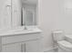 Well-lit bathroom features a vanity with sleek faucet and plenty of space for toiletries at 261 Hawksmoore Ln, Lillington, NC 27546