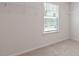 Closet featuring neutral walls, carpet flooring, and a window for natural light at 261 Hawksmoore Ln, Lillington, NC 27546