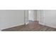 Versatile room featuring French doors, wood-look floors, and neutral walls at 261 Hawksmoore Ln, Lillington, NC 27546
