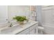 Bright bathroom featuring double sinks with quartz countertops, modern fixtures, and ample storage space at 269 Hawksmoore Ln, Lillington, NC 27546