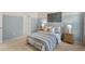 Comfortable bedroom with a queen bed, blue accents, and soft carpet to create a cozy and restful space at 269 Hawksmoore Ln, Lillington, NC 27546
