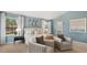Cozy bedroom featuring a large window, neutral walls, and two comfortable accent chairs with throw pillows at 269 Hawksmoore Ln, Lillington, NC 27546