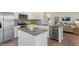 Modern kitchen with stainless steel appliances, granite countertops, and open concept design at 269 Hawksmoore Ln, Lillington, NC 27546
