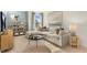 Cozy living room with a sectional sofa, mounted TV, and built-in shelving for a relaxing atmosphere at 269 Hawksmoore Ln, Lillington, NC 27546