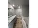 Bathroom featuring a dual sink vanity with granite countertops and a tub at 271 Starry Sky Dr, Benson, NC 27504