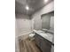Well-lit bathroom featuring a tub and shower combo, vanity with granite countertop, and modern fixtures at 271 Starry Sky Dr, Benson, NC 27504
