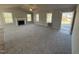 Bright living room featuring a cozy fireplace, large windows, plush carpeting, and plenty of natural light at 271 Starry Sky Dr, Benson, NC 27504