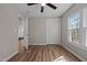 Bedroom featuring vinyl floors, neutral paint, ceiling fan, closet space and natural light at 2810 Hickory Hill Rd, Burlington, NC 27215