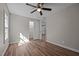 Bedroom featuring vinyl floors, neutral paint, ceiling fan and a closet at 2810 Hickory Hill Rd, Burlington, NC 27215