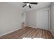 Bedroom featuring vinyl floors, neutral paint, ceiling fan, and closet space at 2810 Hickory Hill Rd, Burlington, NC 27215