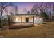 Charming single-story home with a cozy front porch and natural light at 2810 Hickory Hill Rd, Burlington, NC 27215