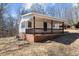 Single-story home featuring a covered front porch perfect for relaxing at 2810 Hickory Hill Rd, Burlington, NC 27215