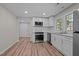 Kitchen featuring stainless appliances, white cabinets, and vinyl floors at 2810 Hickory Hill Rd, Burlington, NC 27215