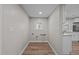 Bright laundry room with new flooring, freshly painted walls, and window at 2810 Hickory Hill Rd, Burlington, NC 27215