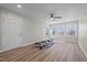 Living room featuring new flooring, fresh paint, and a trio of windows offering ample sunlight and an outside view at 2810 Hickory Hill Rd, Burlington, NC 27215