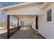 Welcoming covered front porch offers an inviting entrance to the home at 2810 Hickory Hill Rd, Burlington, NC 27215