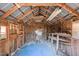 Interior view of shed with wood framing, rafters, and ample storage space at 2810 Hickory Hill Rd, Burlington, NC 27215