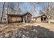 Exterior view of a weathered wooden shed and barn in backyard at 2810 Hickory Hill Rd, Burlington, NC 27215