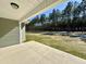A view from the back porch to a wooded lawn at 349 Earnest Way # 21, Kenly, NC 27542